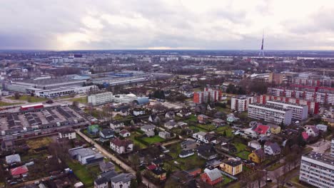 Private-estates,-apartment-and-industrial-buildings-in-Riga-suburbs,-aerial-view