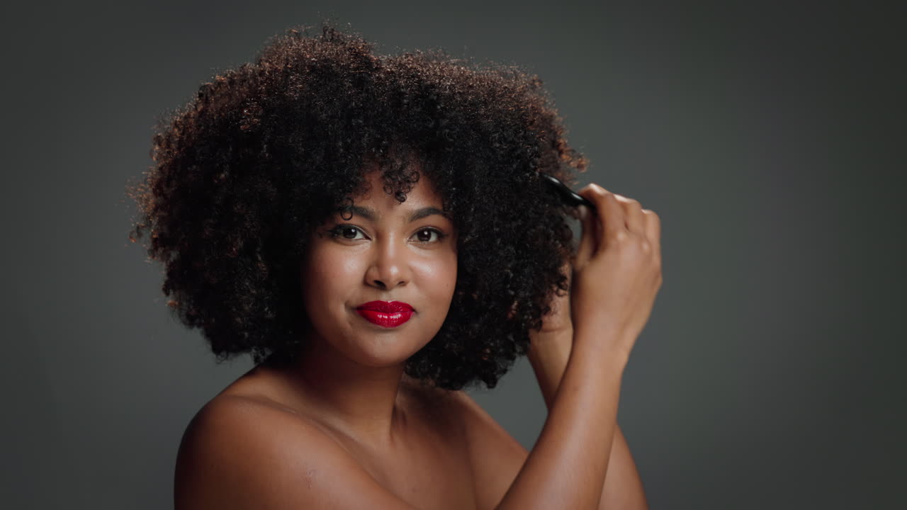 Beautiful Woman with Afro Hairstyle and Red Lipstick