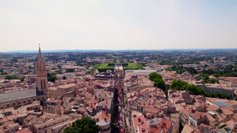 aerial view of montpellier city with the main street filled with people for the gaypride parade