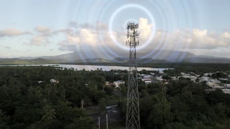 aerial up a cell phone tower over a country town