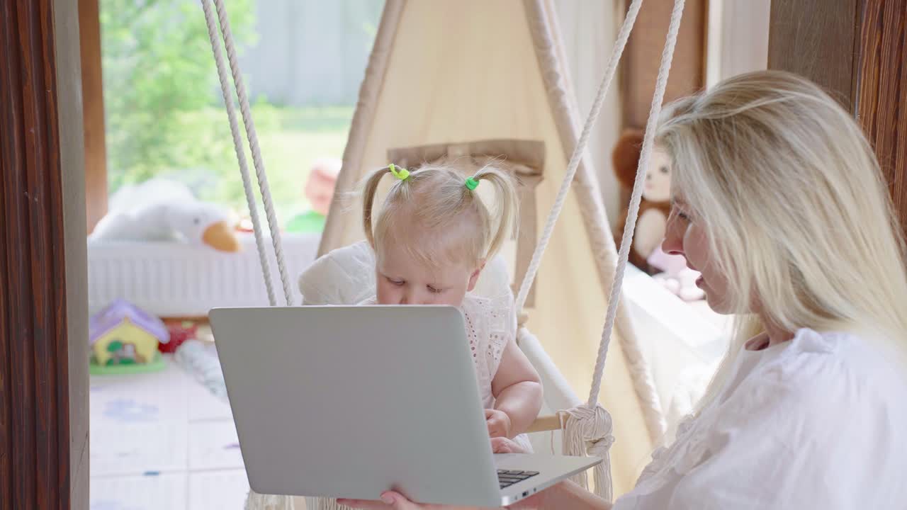 Mother and toddler working from home