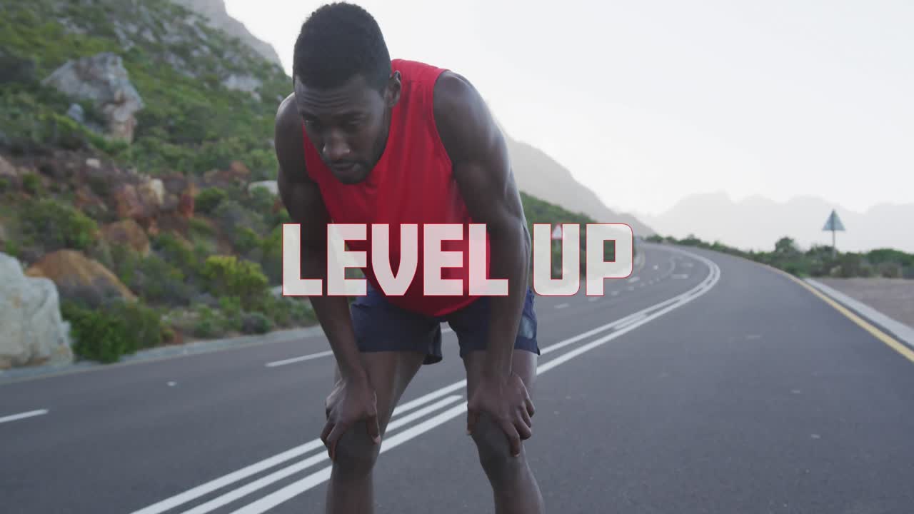 Animation of the words level up in white over man exercising on mountain road taking a rest