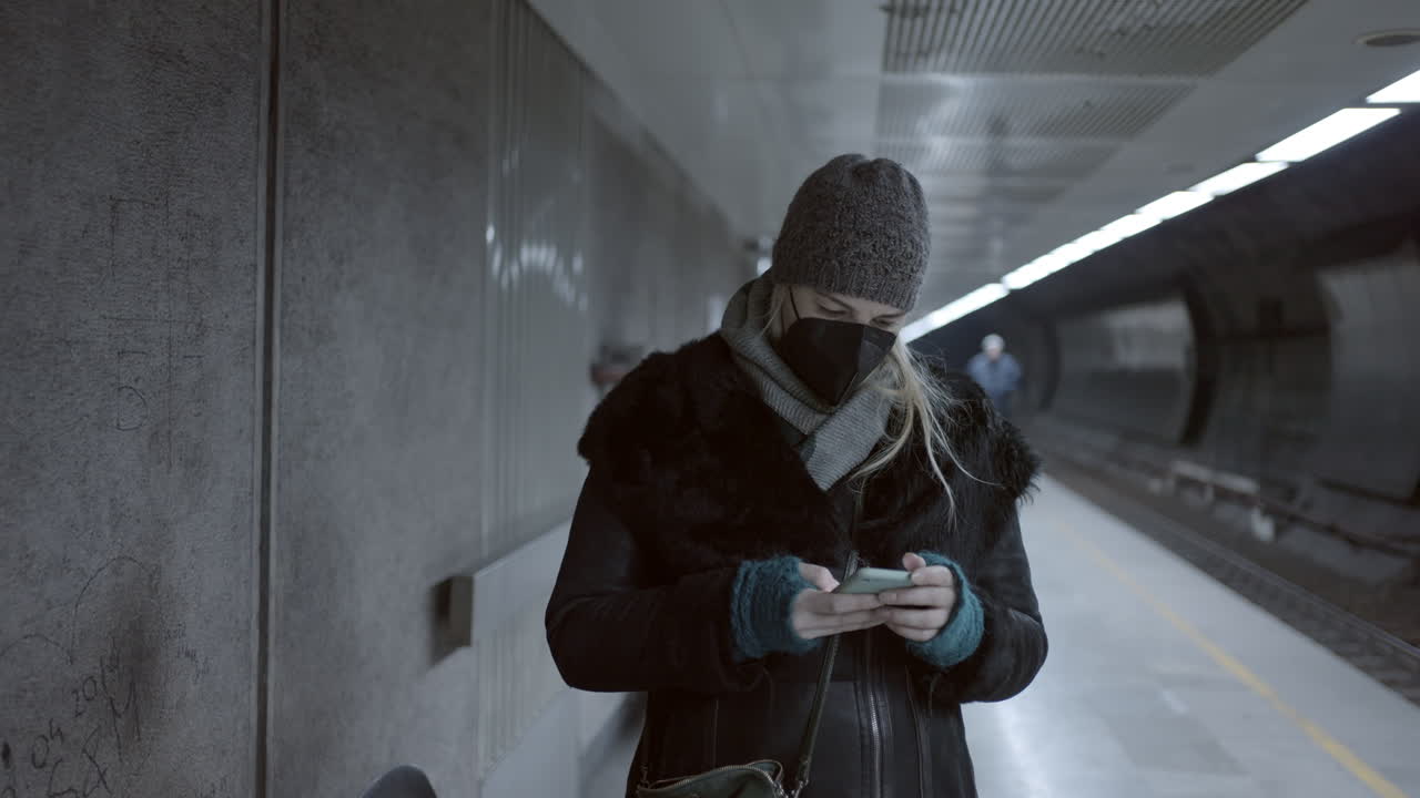 Woman with mask waiting for subway