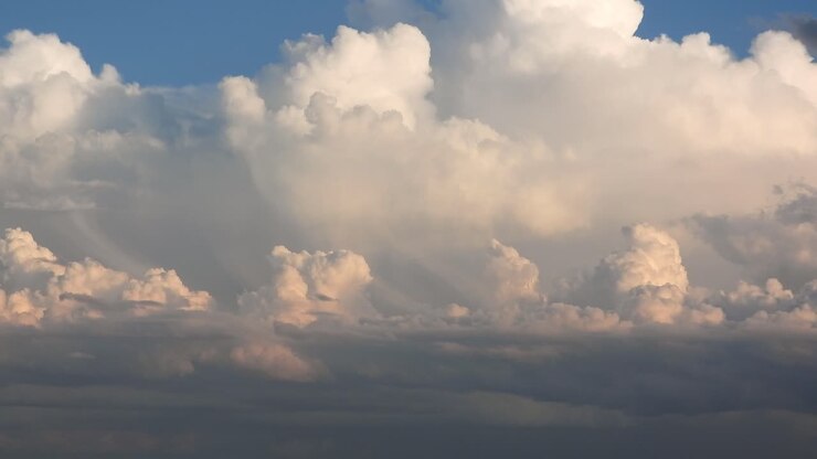 Beautiful Summer’s day sky of white fluffy clouds and a bright blue sky