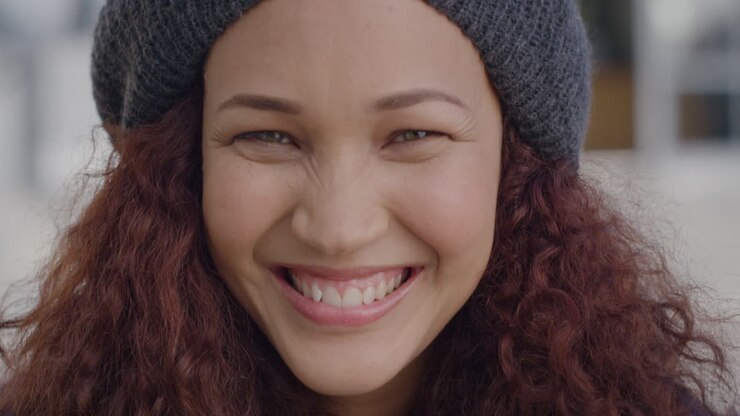 Portrait beautiful student young woman smiling happy in urban city scene