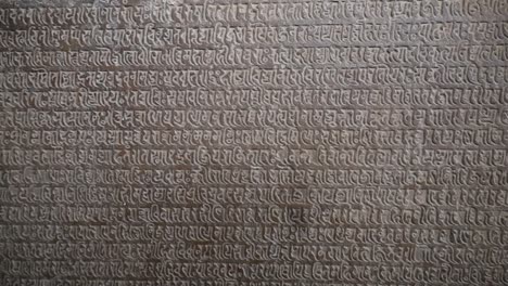 stone inscription in sanskrit at khajuraho temple, unesco world heritage site