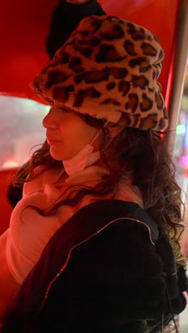 smiling woman in leopard print hat