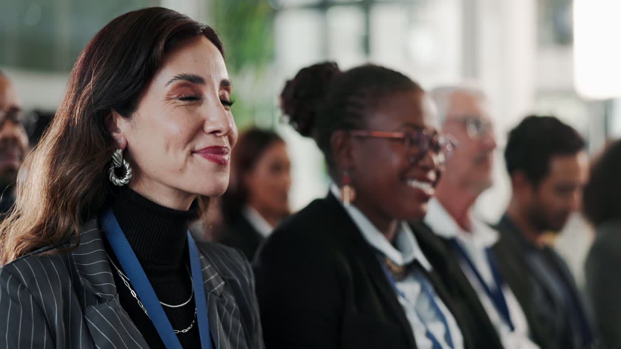 Diverse group of business people listen to a presentation