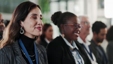 diverse group of business people listen to a presentation