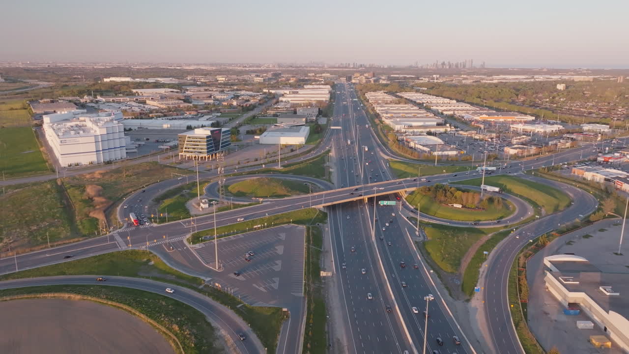 Aerial shot of a highway interchange with trucks and cars on Mississauga's 401