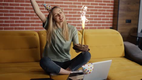 positive woman celebrating distant birthday online with friends video chat