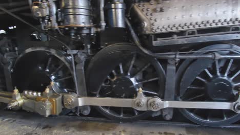 a steam engine backing out of the engine house to start it's day