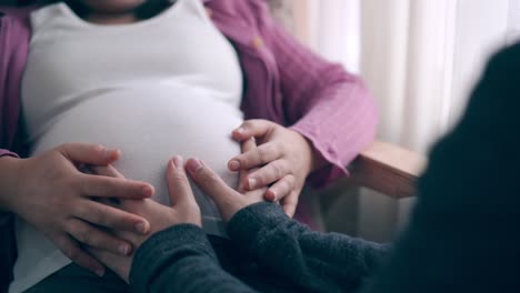 pregnant couple feels love and relax at home.