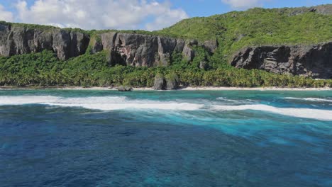 Drone-view-of-Fronton-beach-and-cliffs-in-Las-Galeras-Samana,-Dominian-Republic