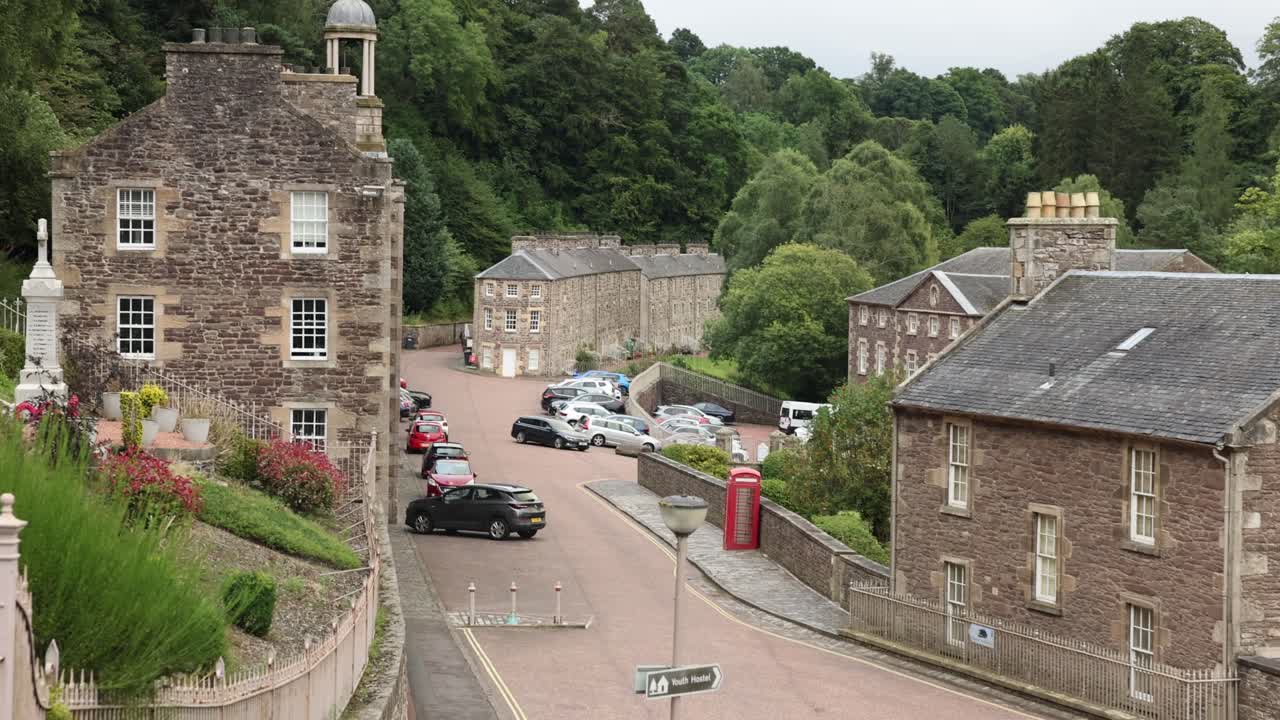 Hand-held shot establishing the UNESCO site within New Lanark, Scotland