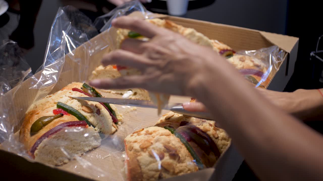 Latina Woman Clutching A Slice Of A Rosca De Reyes And Getting A Baby Jesus On The Slice, On January 6 With Her Family Due To Three Kings Day Celebration In Mexican Family Home