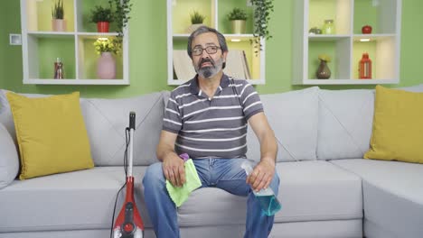 single old man cleaning alone and bored.