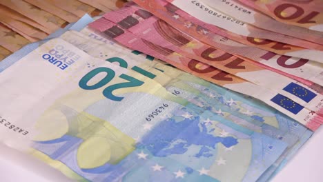 loopable close up of numerous euro banknotes lying on top of each other  on a spinning plate.