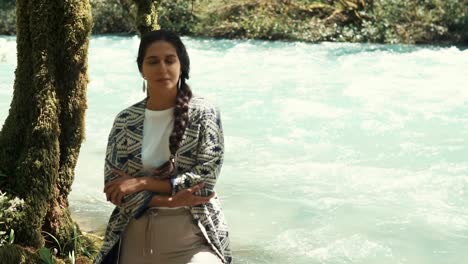 woman relaxing by a river