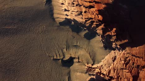 Beautiful-overview-of-the-red-mountains-desert-from-the-sky-with-golden-hour-colours