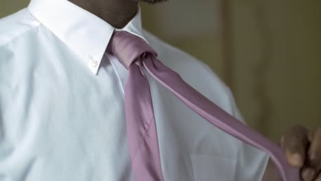 man tying his tie