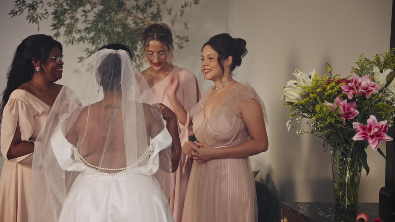 Bridal Party Assisting the Bride on Her Wedding Day