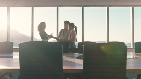 business people shaking hands consultant greeting international clients with handshake planning partnership deal female executive meeting shareholders in corporate office at sunset