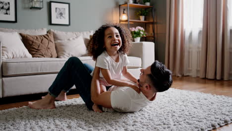 happy father and daughter playtime at home