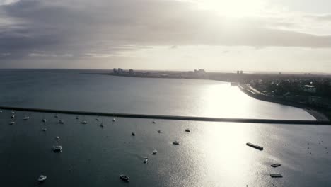 Expensive-yachts,-pleasure-boats-and-catamarans-docked-at-a-city-marina,-at-sunrise-|-Newhaven,-Edinburgh,-Scotland-|-4k-at-30-fps