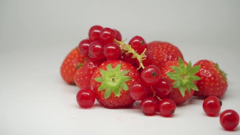 Delicious-Red-Juicy-Strawberries-And-Cherries-Rotating-On-The-Turntable---Close-Up-Shot