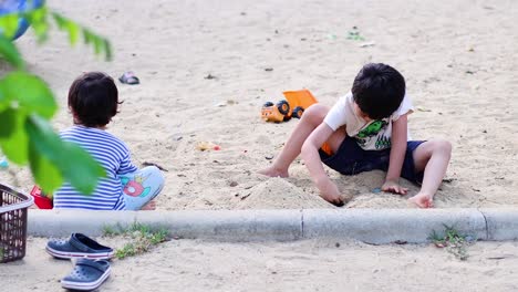 two boys engage in playful activities outdoors