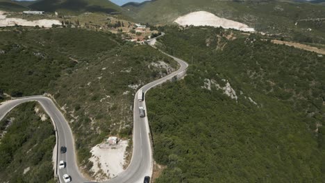 aerial view of vehicles driving on uphill winding road in zakynthos, greece