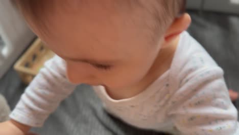 portrait of fussy crying baby, closeup of tired toddler wanting attention from mom