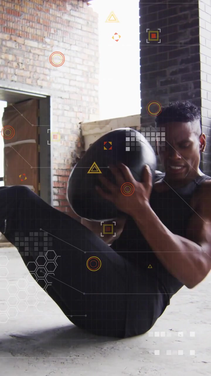 Twisting V-sit athlete in black tank in loft with medicine ball amid HUD overlays for core