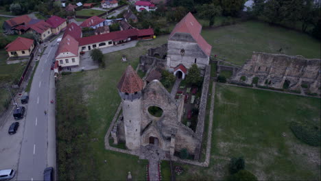 cistercian monastery of carta, cinematic image from a drone. the abbey church in transylvania, romania, over 1,000 years old