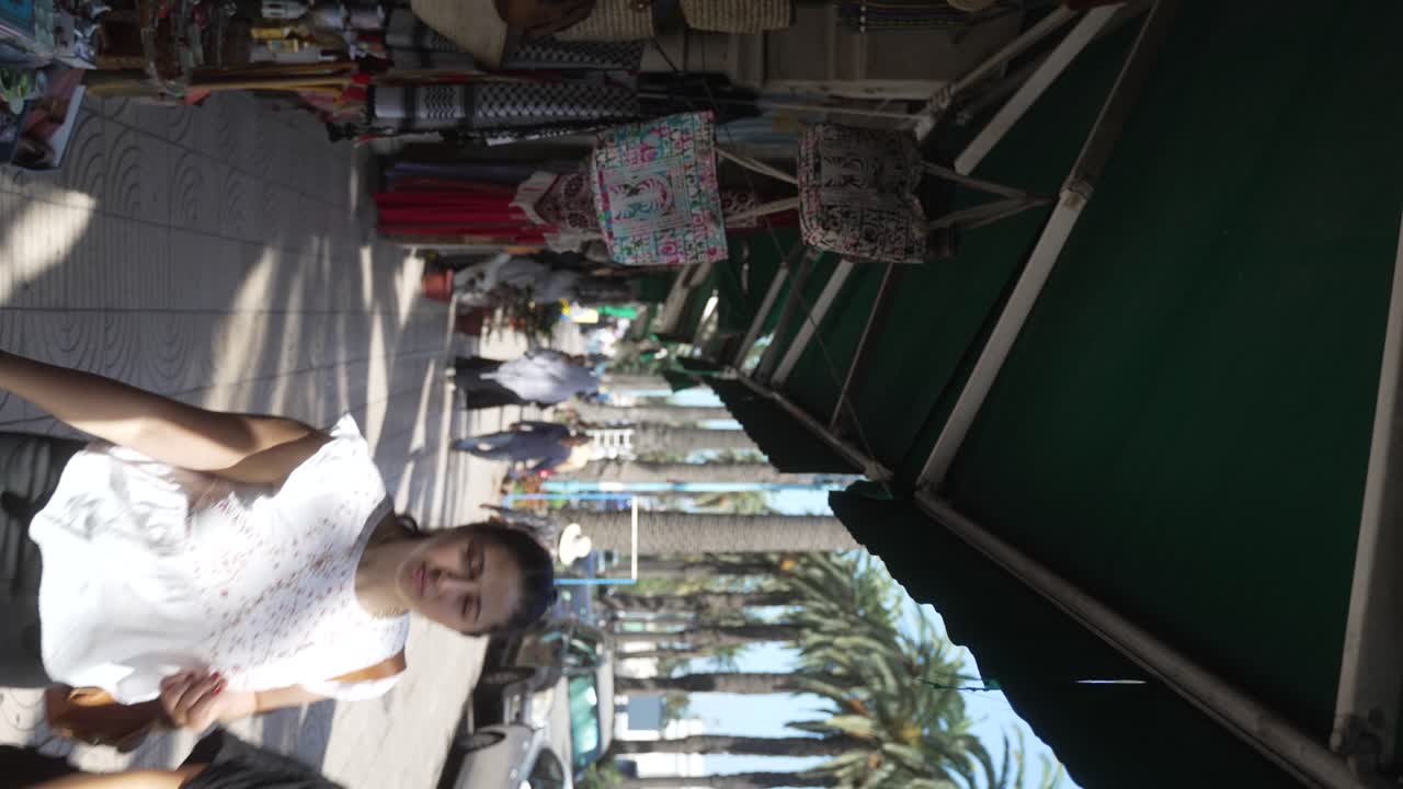 People walking along Central Market in Casablanca, Morocco - vertical