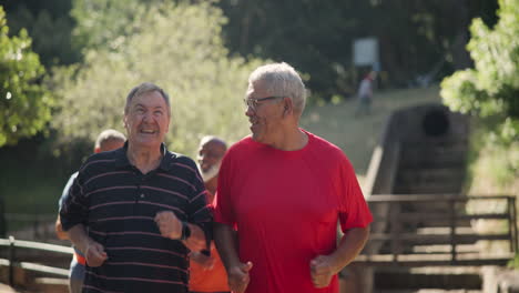 older men running together in a park