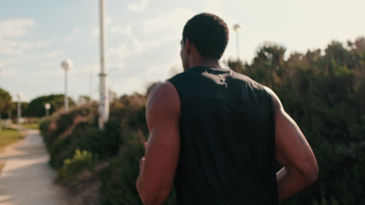 Fit Black Man Jogging in the Park