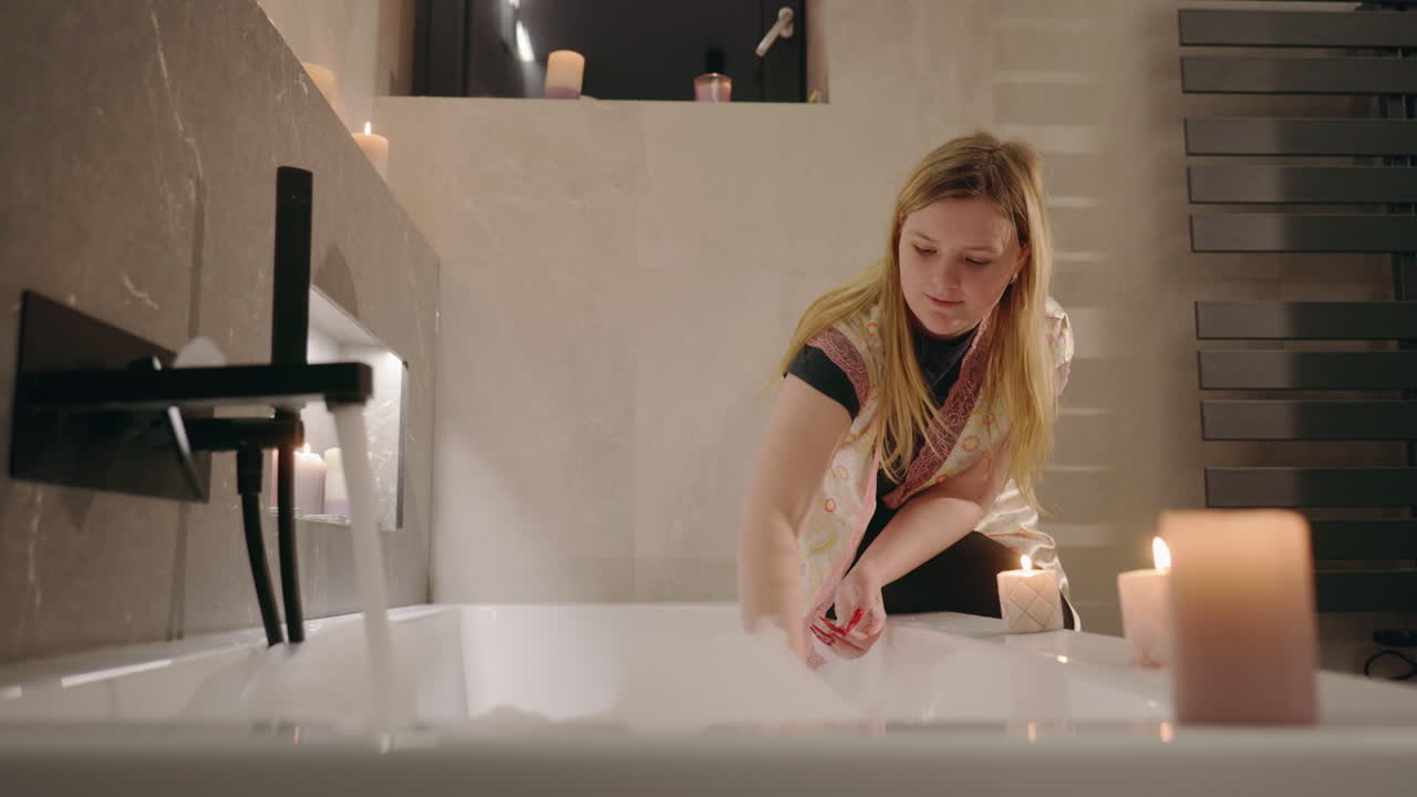 Woman enjoying a relaxing bath in a modern bathroom