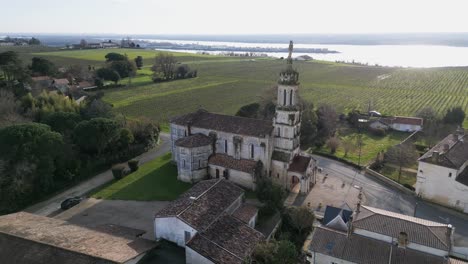 historic notre-dame church, bayon-sur-gironde france. panoramic aerial