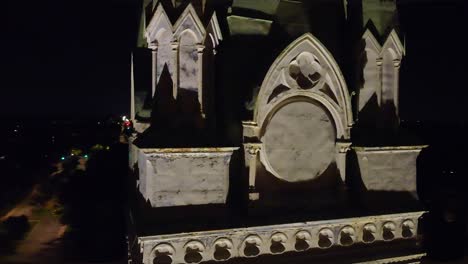 gothic architecture at night: close-up details of a stone tower