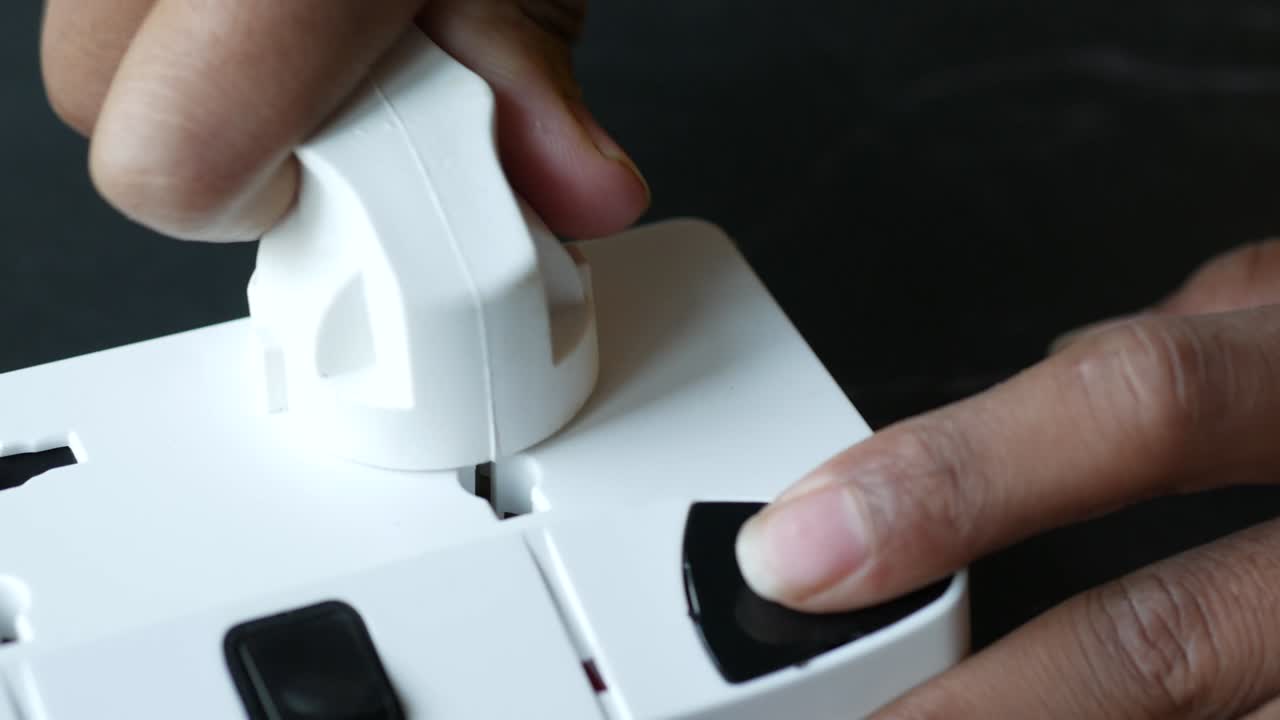 Electrical switch and plug on color background,