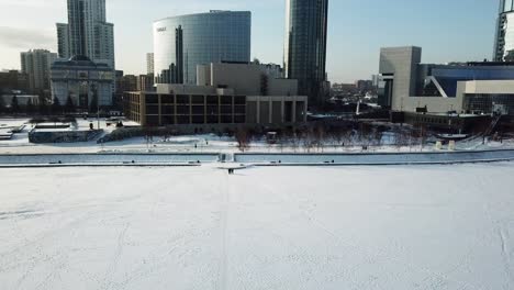 cityscape in winter with frozen river