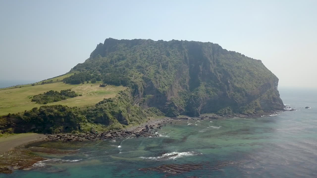Drone footage of Sunrise Peak (Seongsan Ilchulbong) on Jeju Island, South Korea.