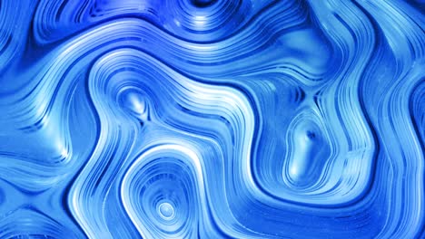 looped abstract liquid background with wavy sparkling pattern on shiny glossy surface. viscous blue fluid like surface of foil or brilliant glass. beautiful creative festive backdrop. simple bright bg