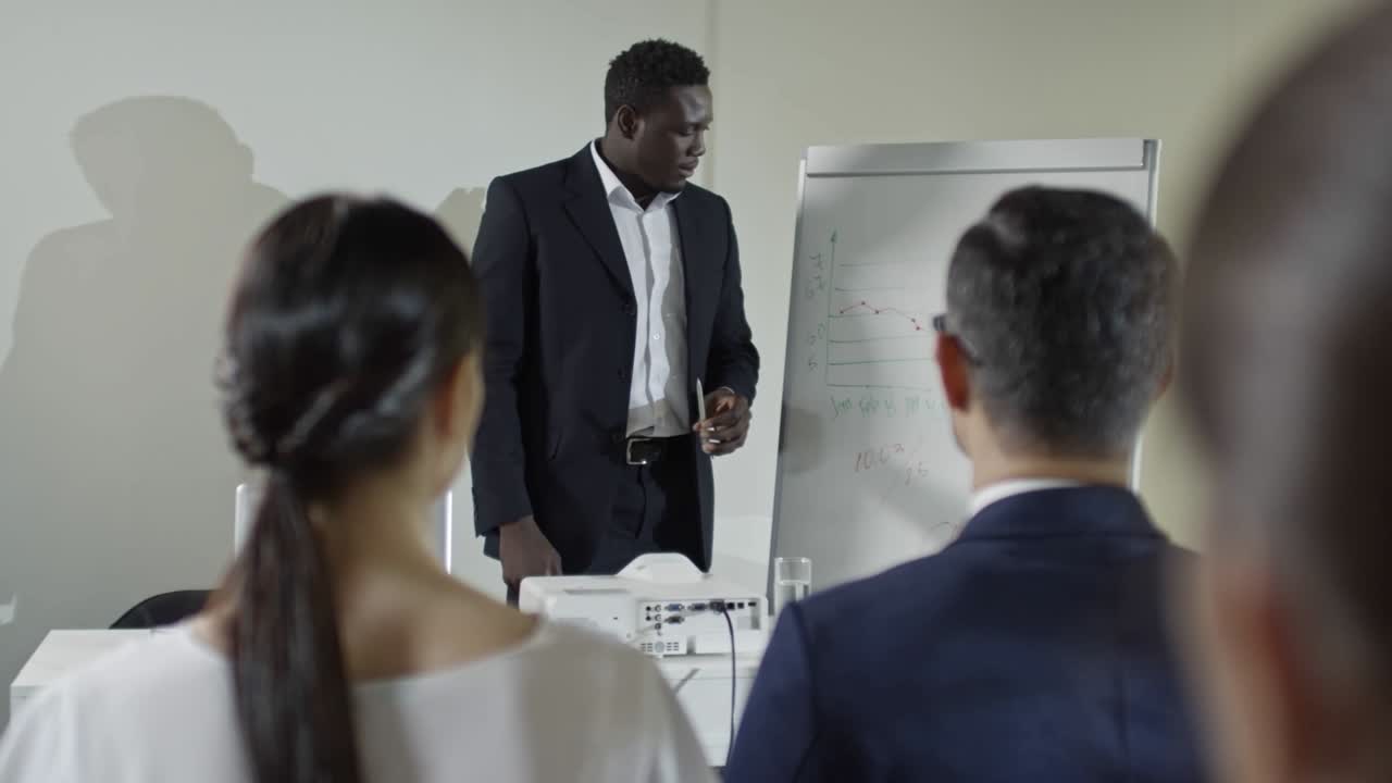 African Businessman Explaining Financial Report