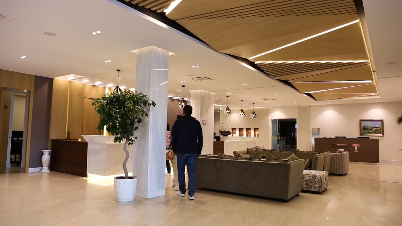Two people entering in the hotel reception