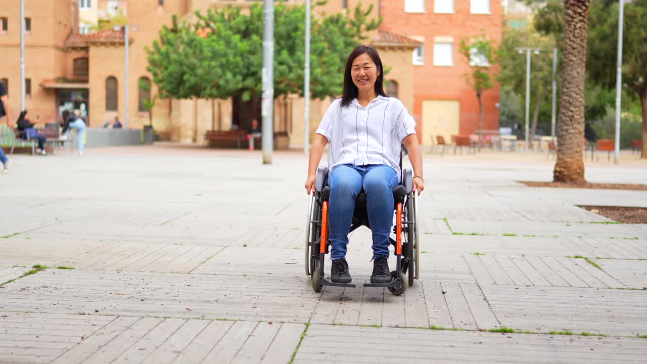 Two women with disabilities enjoying a sunny day in the park