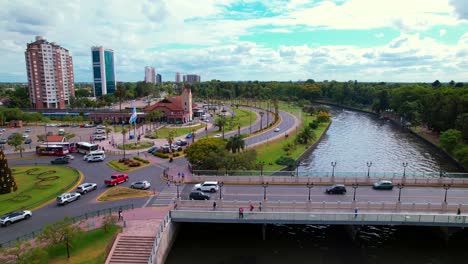 aerial orbit of the arístedes sacriste bridge with high traffic with the argentine flag and the tigre station in the province of buenos aires, argentina