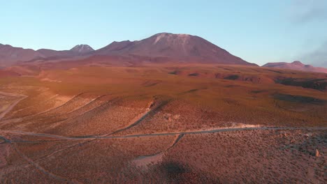 aerial cinematic shot of lã¡scar volcano in the atacama desert, chile, south america